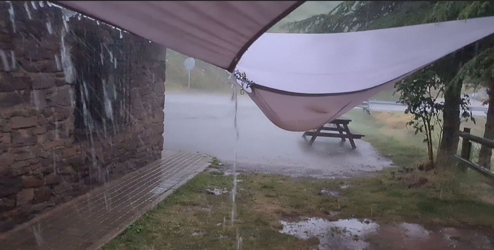 A heavy thunderstorm with hail and lightning greeted me at the summit at 1,720.8 meters 