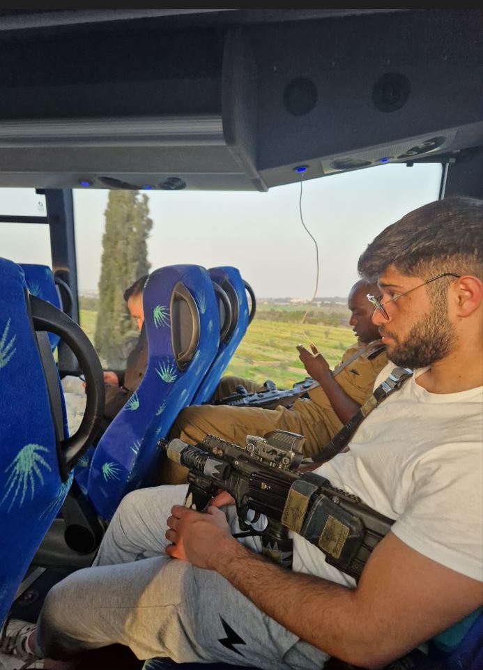 Rather normal situation in Israel - the guy next to me dozed off, barrel pointing at me...