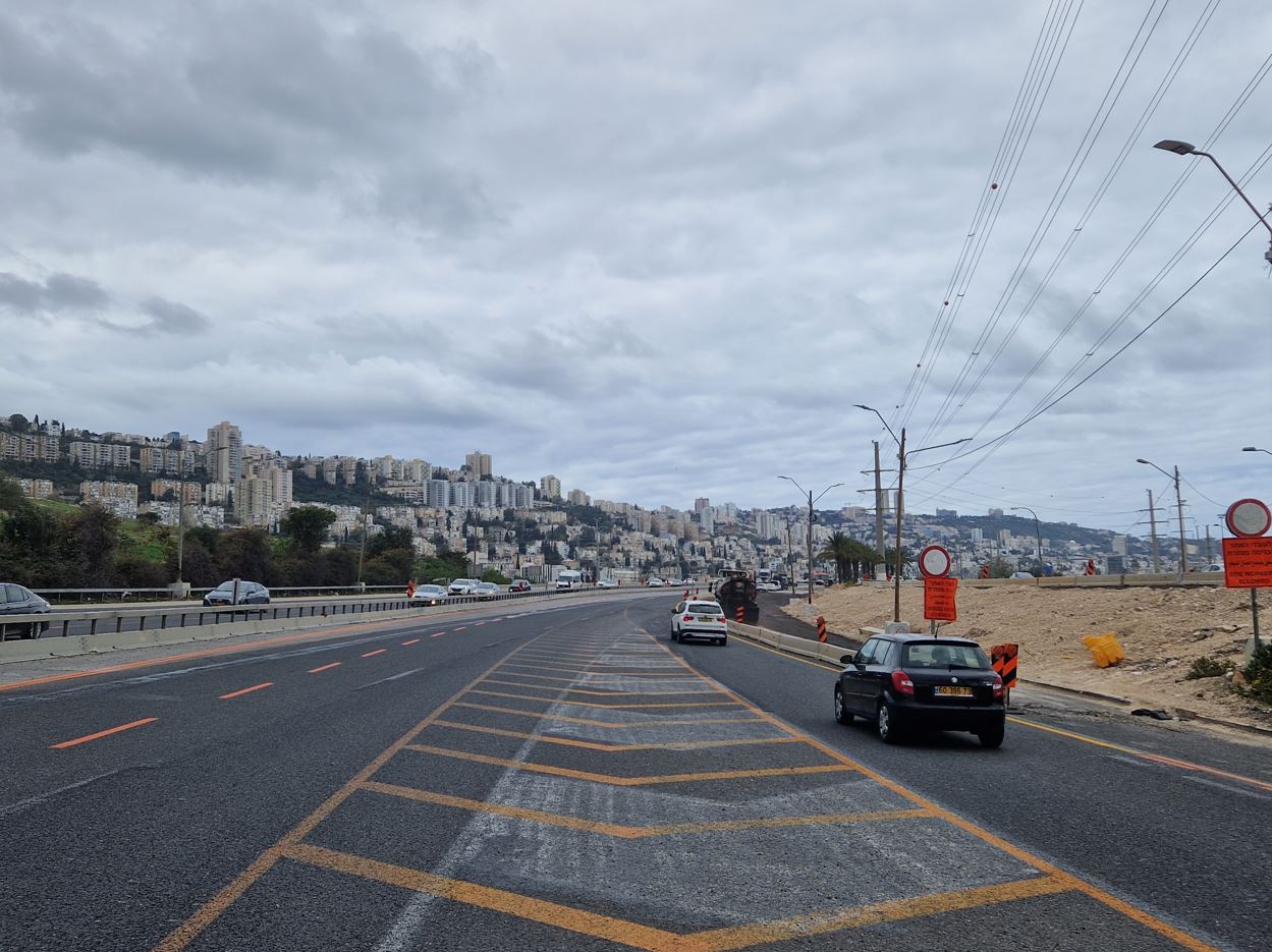 Road works, not the safest places to ride a bike...behind the towering houses of Haifa