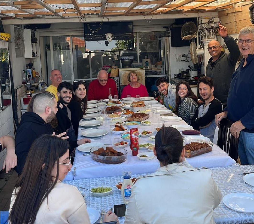 Celebrating life (the author in yellow and his parents are in the very back)