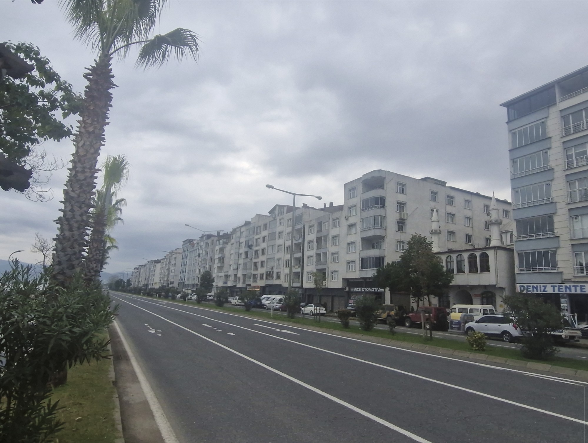 Rather dull houses line the shore